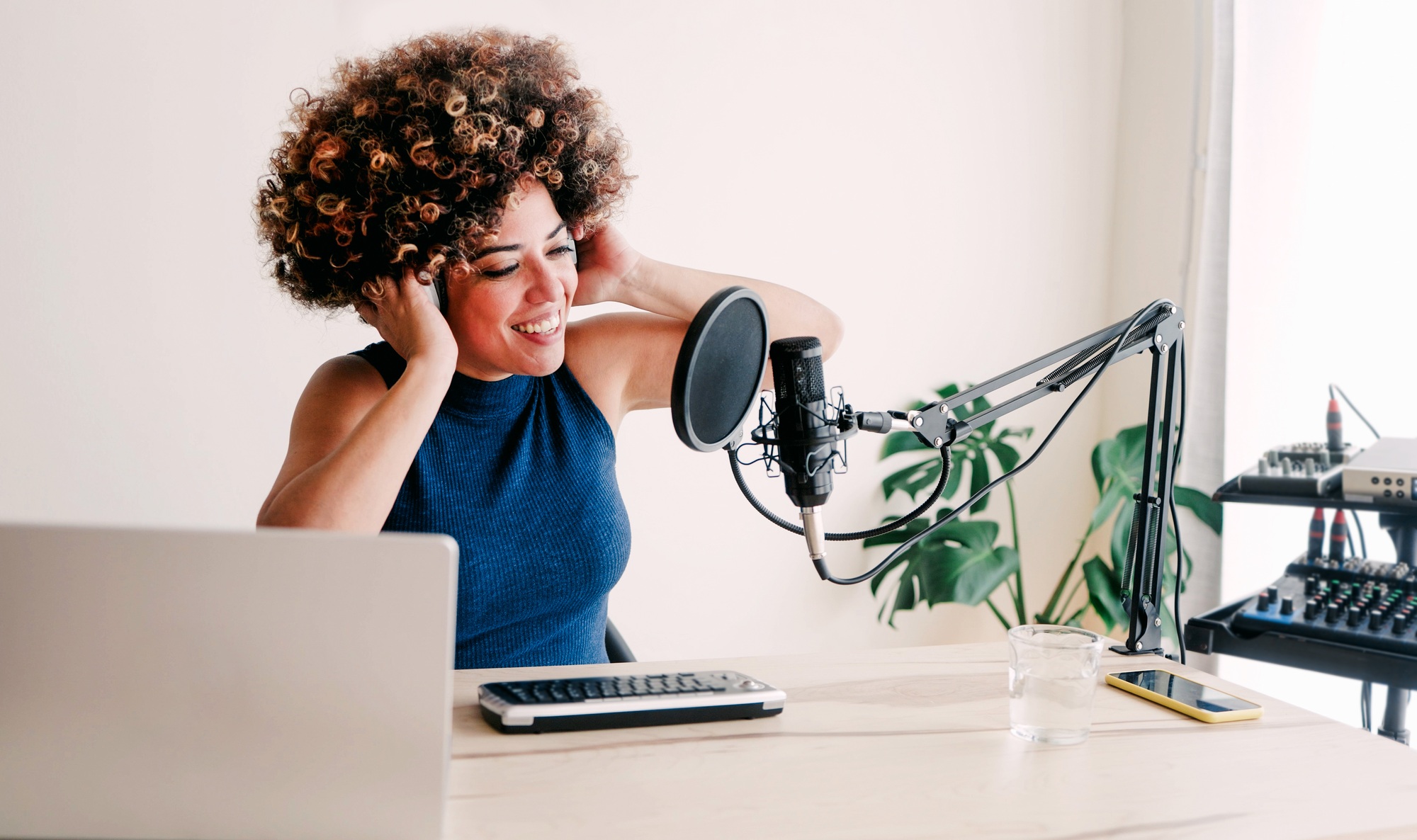Latina woman recording live podcast radio. Content creator and media communication concept